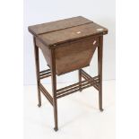 Early 20th century Oak Sewing / Work Table the twin hinged lid opening to a fitted interior