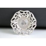 A fully hallmarked sterling silver pin dish with art nouveau decoration. Measures 9.5cm wide