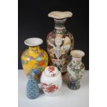 Four Oriental ceramic vases to include a large baluster-form example with enamelled figural