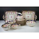 Early 20th Century Cauldon tea set, with pink cabbage rose and gilt decoration, cobalt blue glazing,