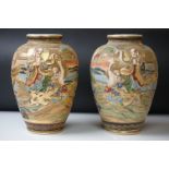 Pair of 20th Century Japanese Satsuma vases of ovoid form, with relief moulded seated figures and