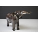Beswick Elephant model, with trunk outstretched, gloss finish, model no. 974 (measures appprox