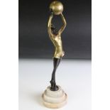 Art Deco style patinated bronze figure of a dancing girl with ball, marked 'Lorenzl', raised on a