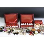 A collection of trinket boxes to include enamel examples together with two cased sets of silver