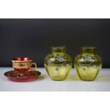 Pair of Victorian green glass vases with enamelled floral decoration, of ovoid form (10.5cm high),