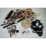 A small collection of vintage and contemporary costume jewellery and watches.