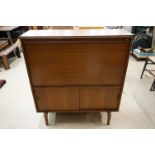 Mid century Retro Teak Cocktail Cabinet, the upper section with drop front opening to formica