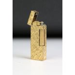 A mid 20th century textured gold plated Dunhill pocket lighter.