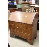 Edwardian Oak and Walnut Bureau, the drop front opening to a fitted interior, over three long