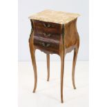 French Walnut Bedside Cabinet of serpentine form, the marble top over three feather banded