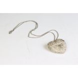 A fully hallmarked sterling silver heart shaped pendant on a sterling silver chain link necklace.