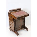 Victorian Rosewood Davenport with hinged lid opening to a fitted stationery rack, the sloping