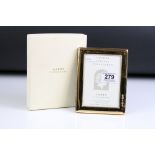 A boxed fully hallmarked sterling silver 23ct gold plated photograph frame.