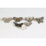 A collection of seven silver filigree butterfly brooches.