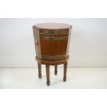 George III Mahogany and Brass Bound Octagonal Cellarette with lion mask drop ring handles, the