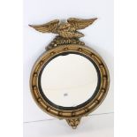 Mid 20th century Atsonea Gilt finish Circular Convex Wall Mirror in the Regency style surmounted