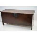 17th / 18th century Oak Six Plank Coffer, the lid with moulded edge and raised on v shaped ends,