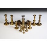 Four Pairs of Brass Candlesticks, tallest 10cm high together with two other Brass Candlesticks and