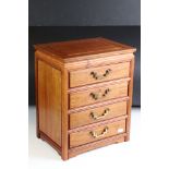 Early-to-mid 20th century wooden four drawer table-top cabinet, the drawers with Art Deco style drop