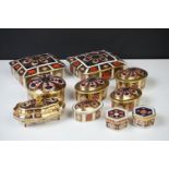 Ten Royal Crown Derby Imari pattern lidded trinket boxes and storage jars, largest approx 11cm wide