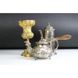 An ornate antique silver plated teapot together with a silver plated hot chocolate pot and a