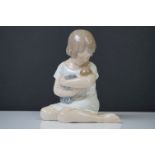 Royal Copenhagen porcelain figure of a girl with baby, no. 1938, 13cm high