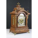 A 20th century German made mantle clock with chiming movement together with a French mahogany