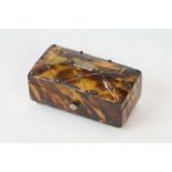 An antique faux tortoiseshell trinket box with central cartouche to the hinged lid and turned bone