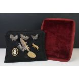 A small collection of brooches to include filigree Butterflies together with two display stands.