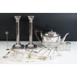 A collection of mixed silver plate to include teapot, candlesticks, salts and cutlery.