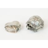 A hallmarked sterling silver pill box in the form of a tortoise together with a silver pill box in