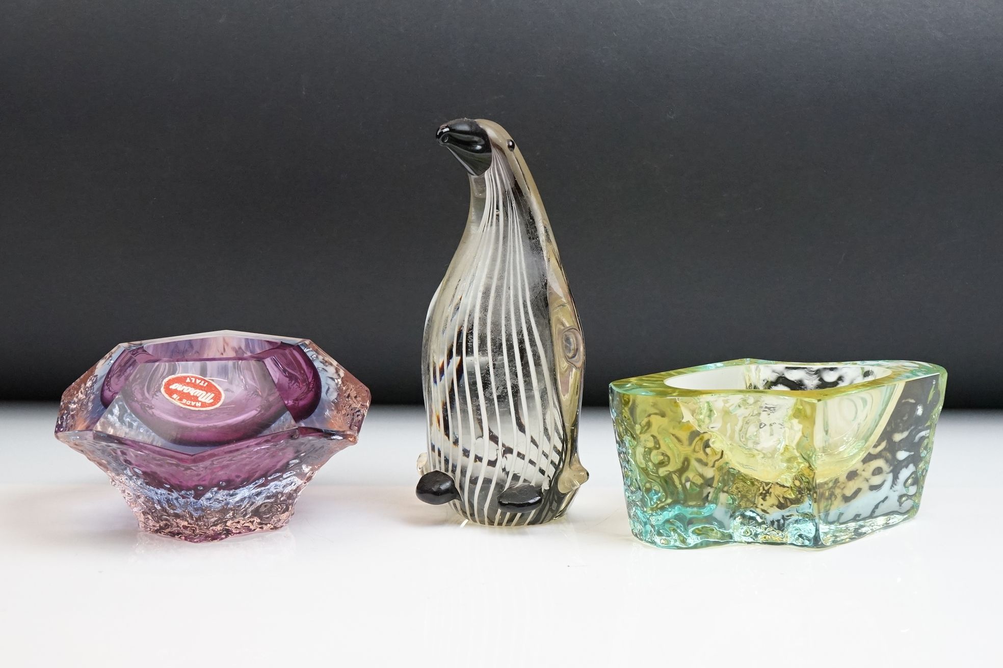 Two Murano textured glass ashtrays to include a faceted geometric example in an amethyst