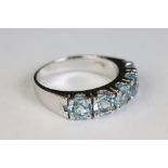 Silver and blue topaz five stone ring