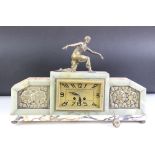 An Art Deco marble and green onyx mantle clock with female figure to the top, the clock face