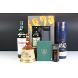 A small collection of bottled alcohol to include a Glenlivet gift set and a Wade Bells Whisky bottle