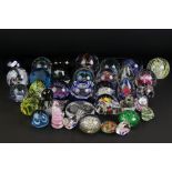 Collection of approximately Thirty Five Glass Paperweights including Caithness and Langham, some