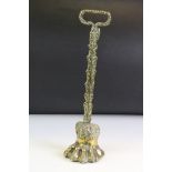 19th century Brass ' Lion Paw ' Doorstop with foliate loop handle and weighted base, 39.5cm high