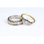 A ladies 18ct gold and diamond ring together with an eternity ring.
