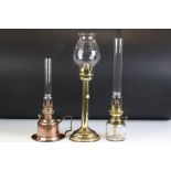 Brass Spring Loaded Candle Holder with glass shade, 39cm high together with Two Oil Lamps with