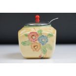 Clarice Cliff for Newport Pottery - Preserve jar with floral and green banding decoration, on a