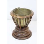19th century Mahogany Coal Bucket / Jardiniere with slatted sides and circular plinth base, brass