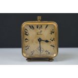 A brass cased Art Deco French made travel alarm clock.