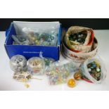 A collection of vintage marbles contained within three boxes.