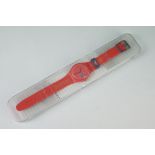 A cased Swatch London 2012 olympics quartz wristwatch.