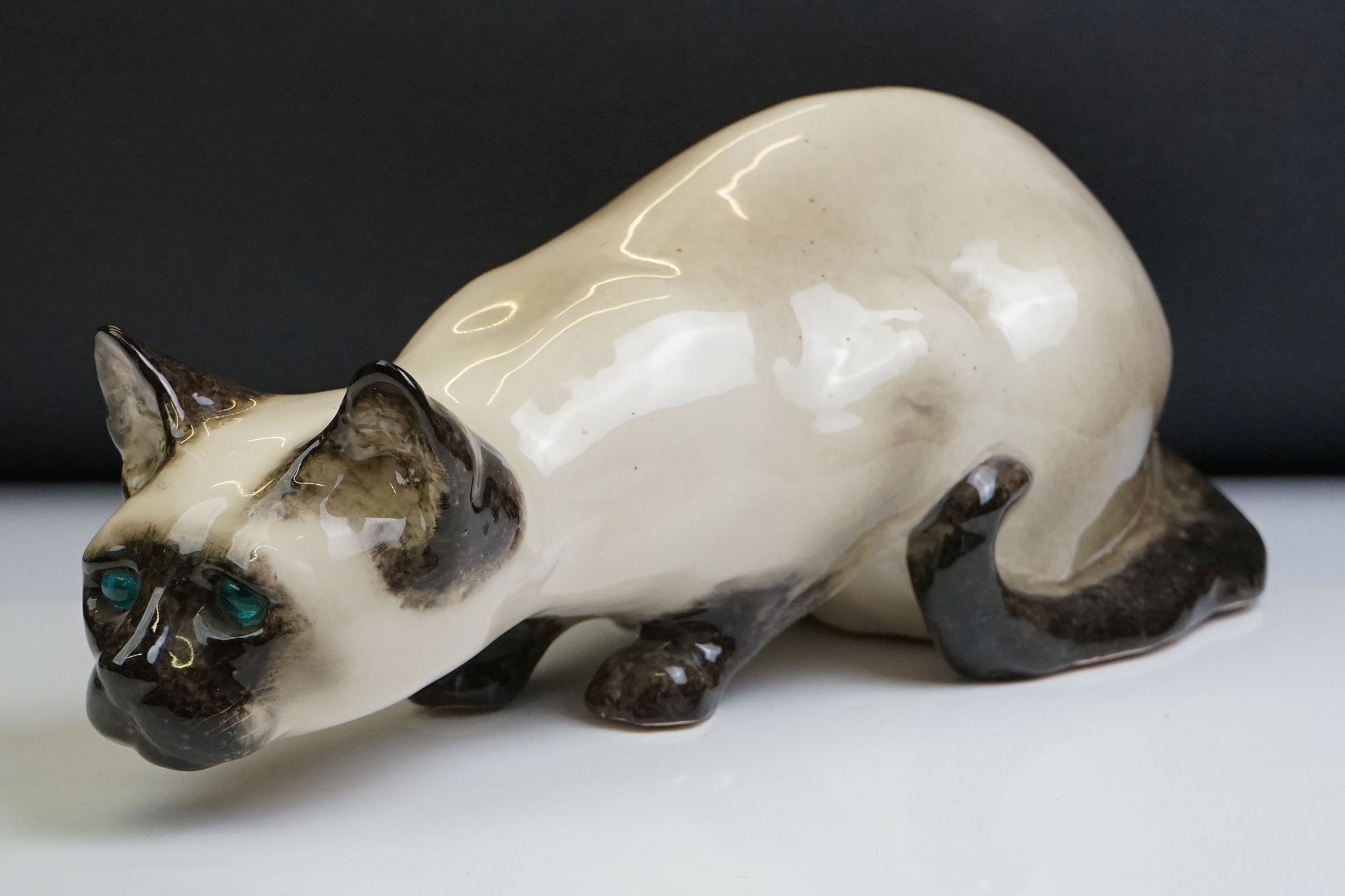 Winstanley pottery figure of a crouching Siamese cat with blue glass eyes, signed to the base and - Image 2 of 14