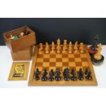 Two vintage boxwood chess sets together with wooden chess board and two associated brushes.