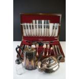 A canteen of silver plated cutlery together with a silver plated teapot and coffee pot and a