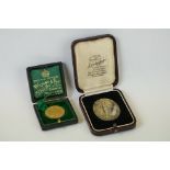 A cased hallmarked 9ct gold medal for excellence and purity together with a cased silver Hovis bread