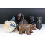 A group of five carved wooden animals to include a Black Forest style bear, two owls and two ducks.