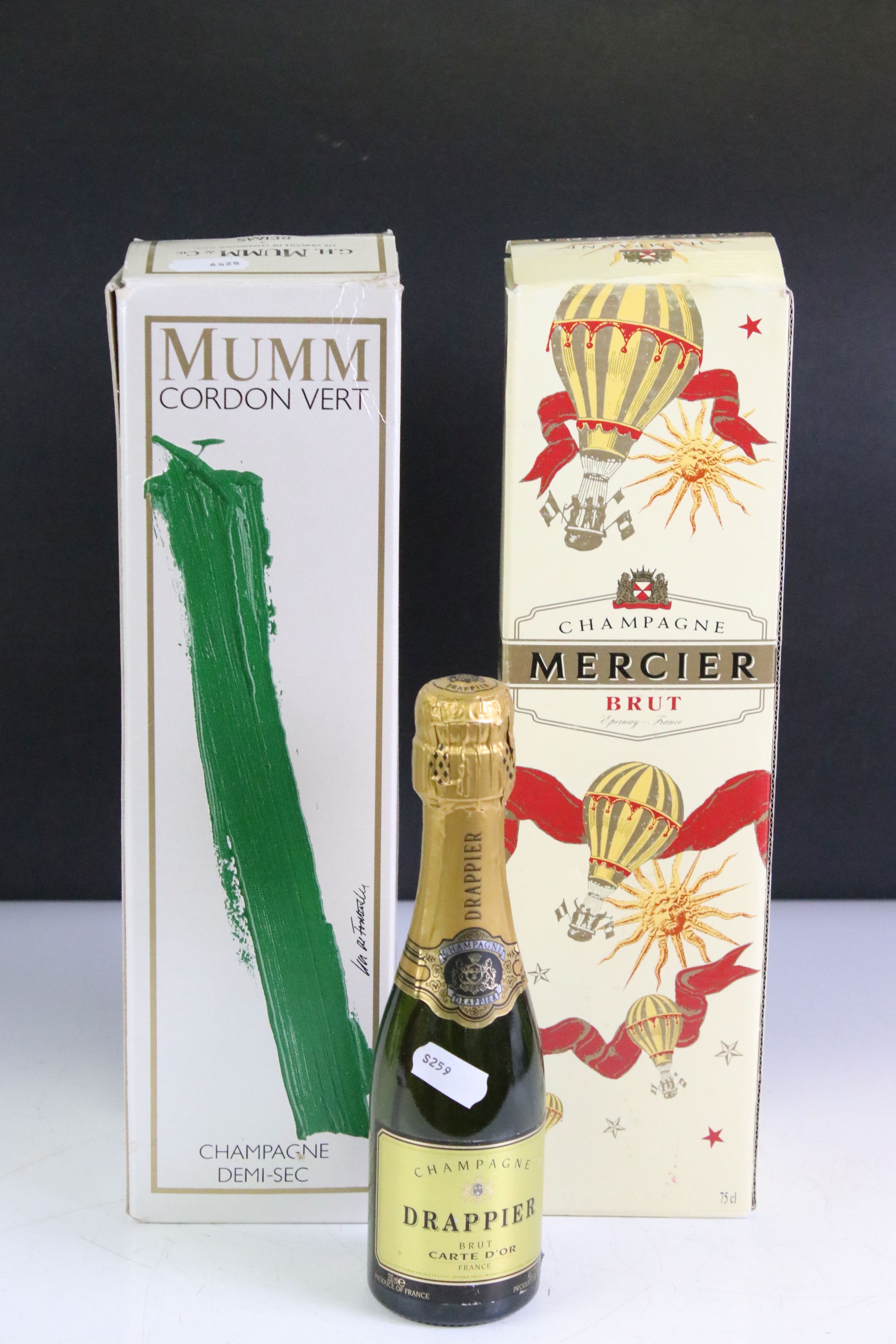 A collection of three bottles of Champagne to include Mercier Brut, Mumm Cordon Vert and Drappier